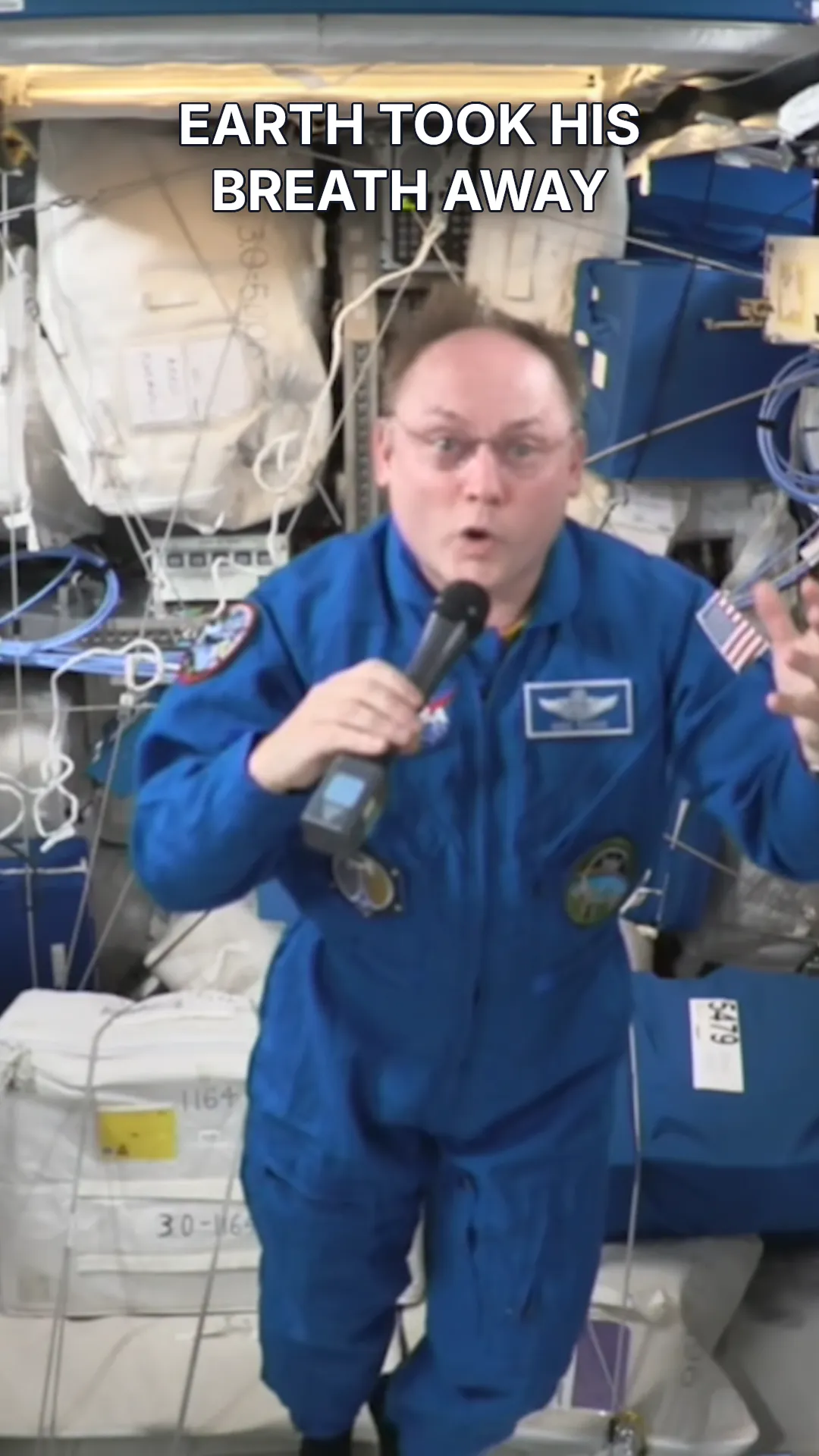 Astronaut in a blue flight suit beneath the title “Earth took his breath away.”