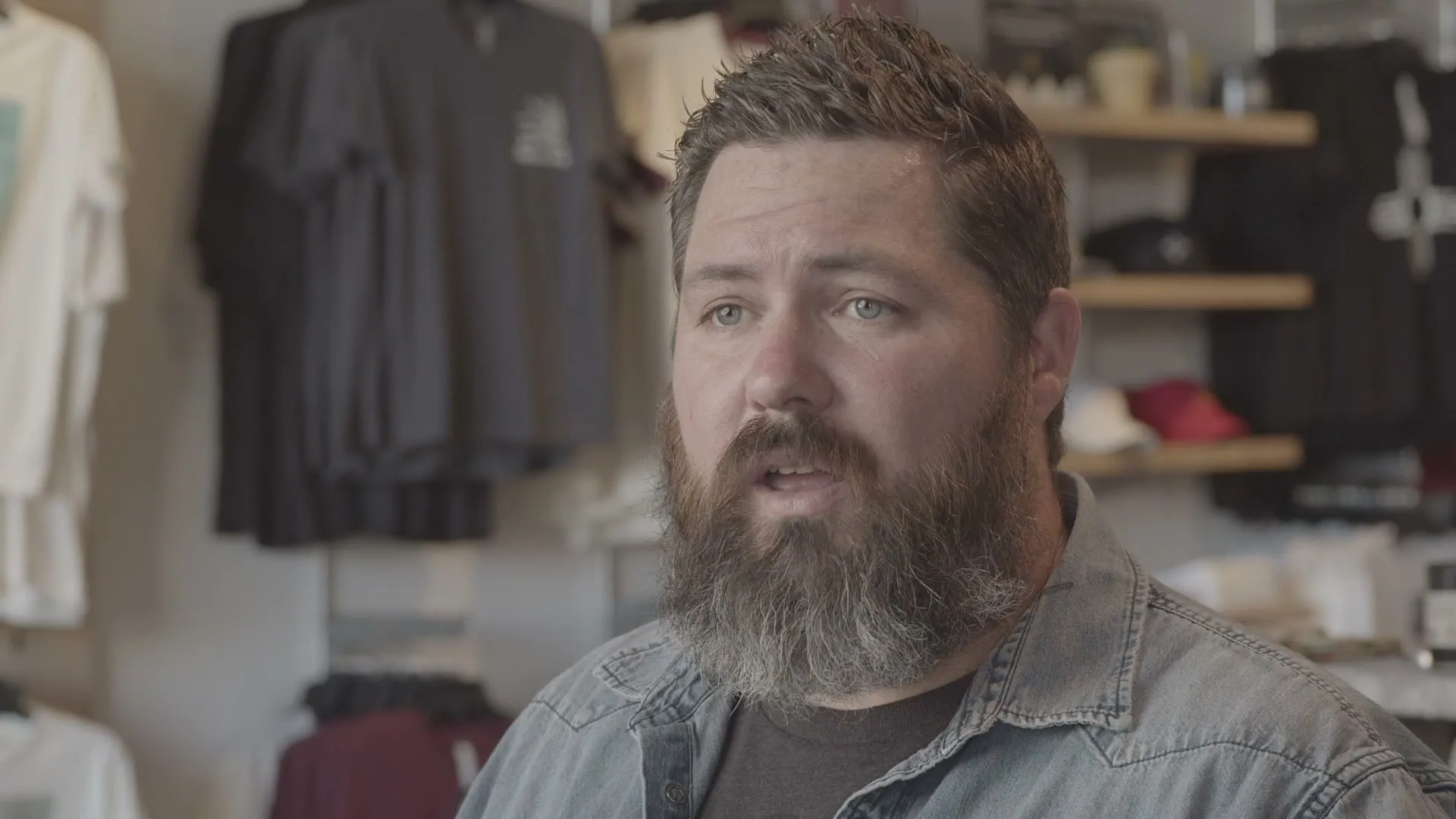 The Organ Mountain Outfitters founder speaking inside the store.