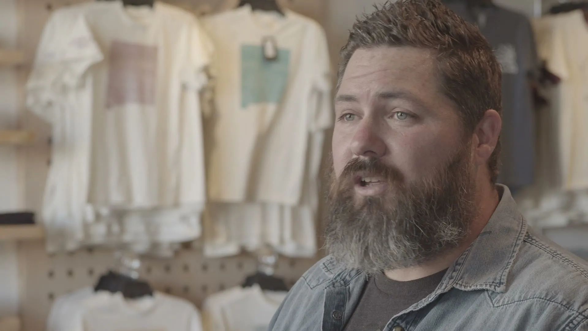 The Organ Mountain Outfitters founder speaking inside the store.